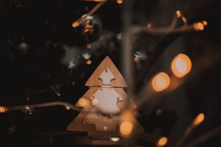 Emerging Trends - a wooden christmas tree with lights around it