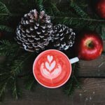 Sustainable Coffee - red coffee latte on white ceramic mug