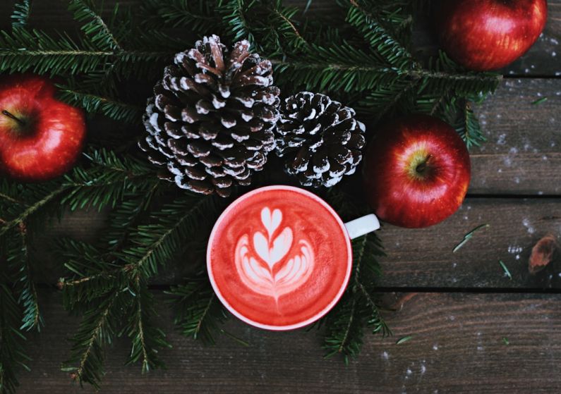 Sustainable Coffee - red coffee latte on white ceramic mug