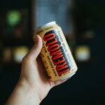 Nitro Coffee - a hand holding a can of food