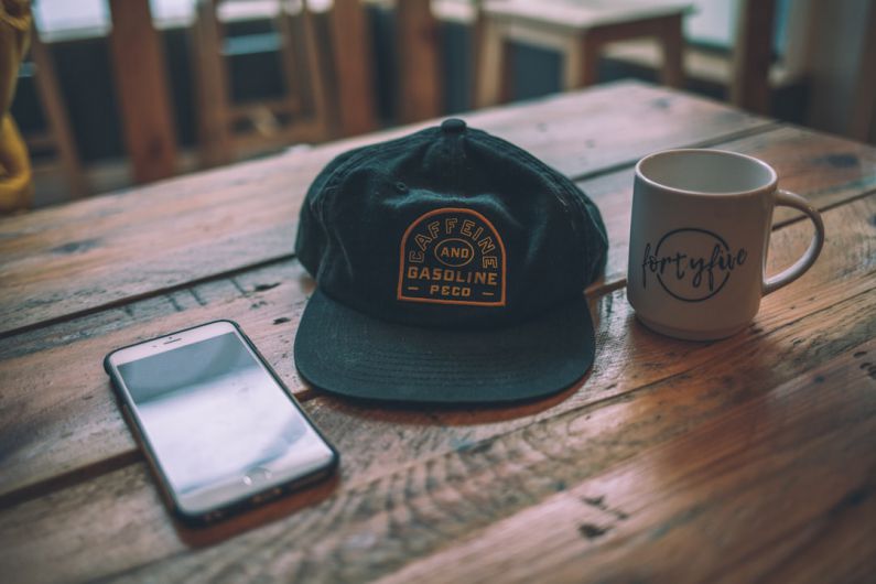 Single-Origin - black cap beside mug