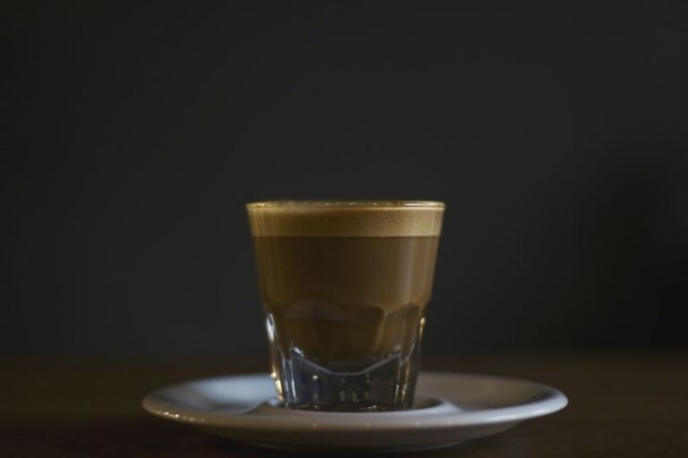Espresso Crema - coffee filled rock glass on saucer