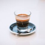 Espresso Technique - clear glass cup on saucer