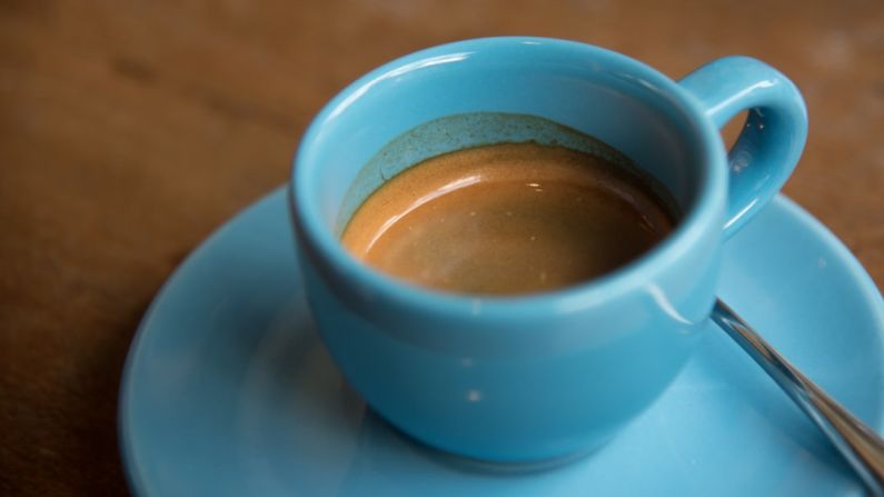 Bitter Espresso - half-filled ceramic cup on saucer