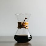 Chemex - clear glass decanter filled with black liquid