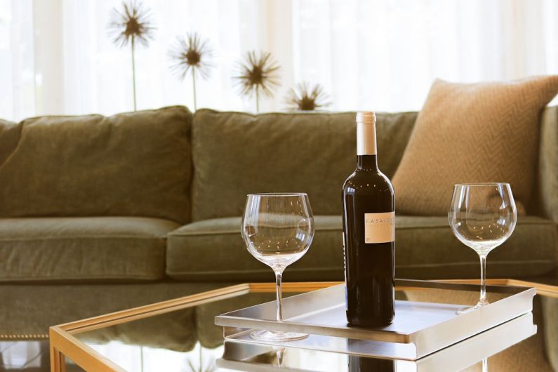Home Grinders - black wine bottle beside two wine glasses