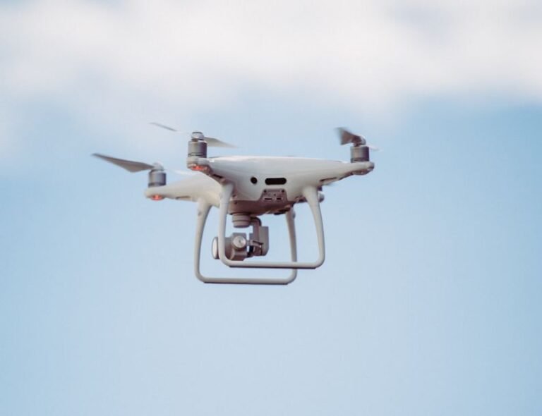 Advanced Equipment - white DJI drone in mid air